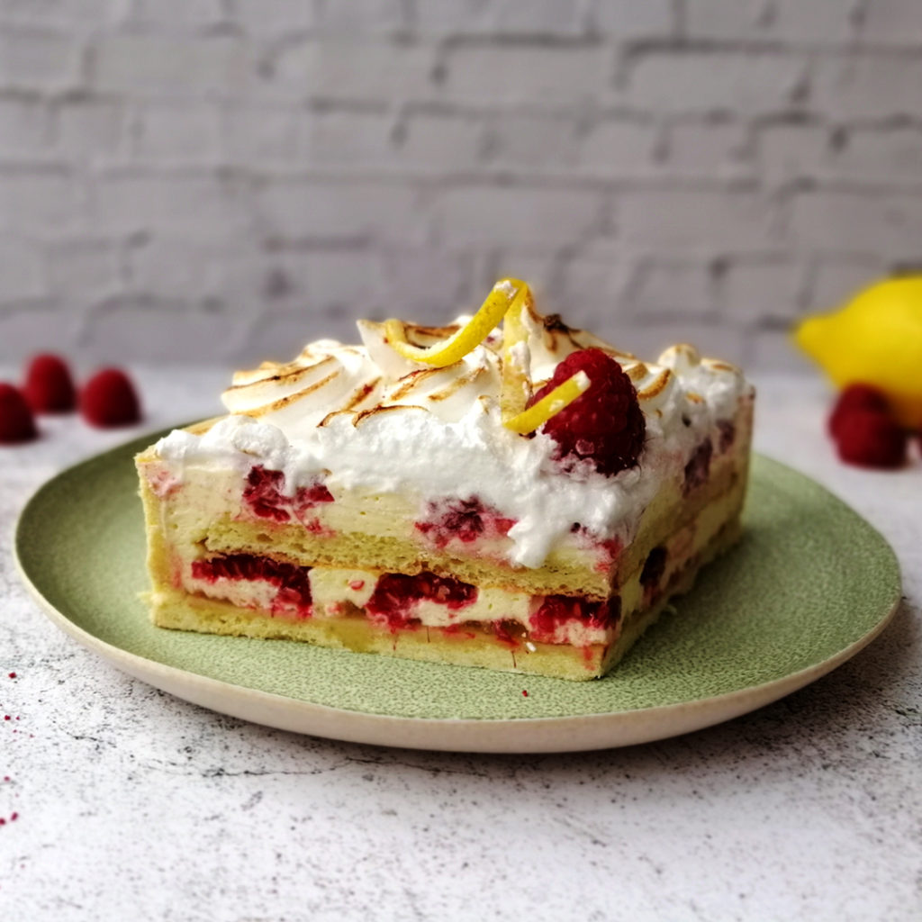 Raspberry and lemon white chocolate tart slice with inside layers