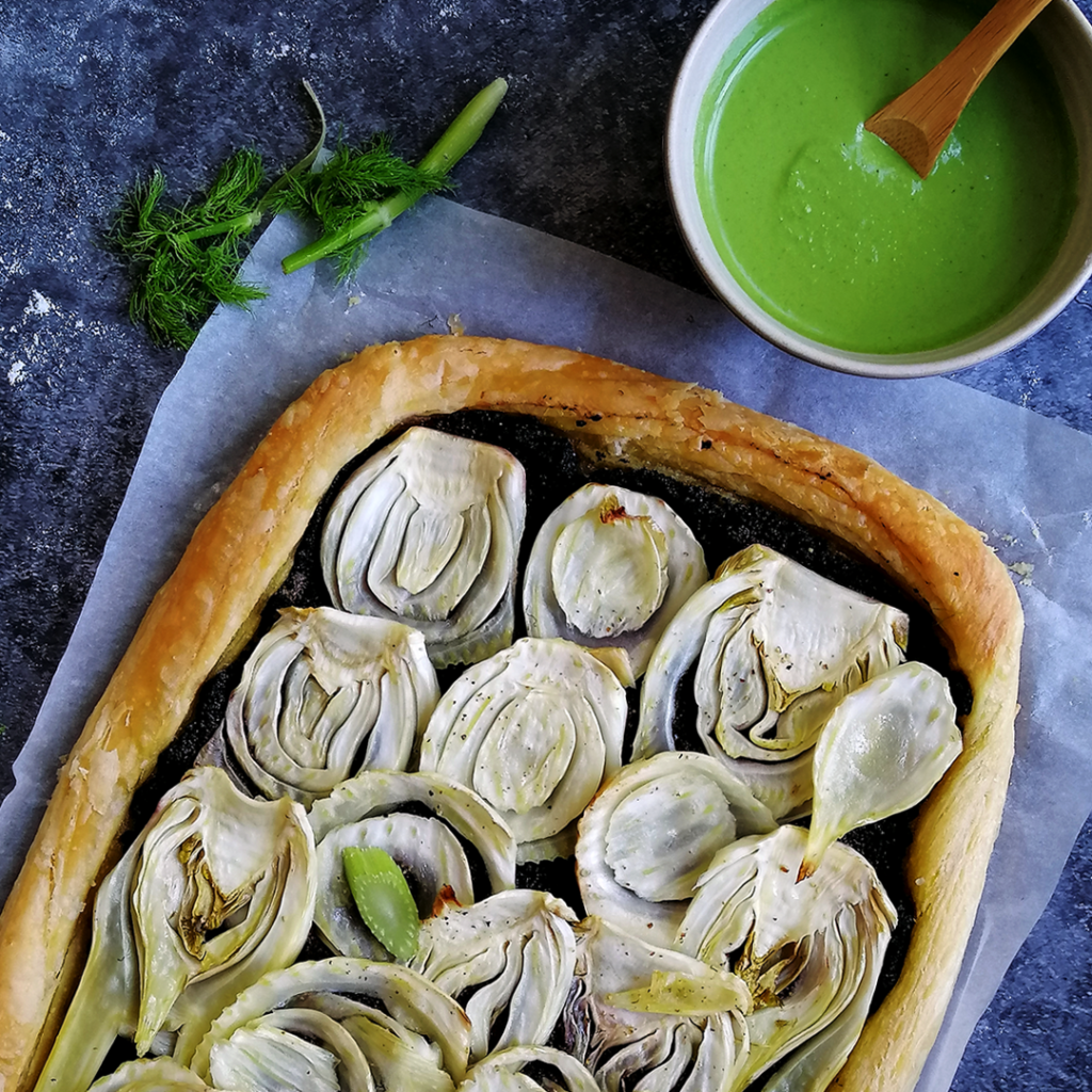 Fennel, olive tapenade tart before the final drizzling of spinach pesto