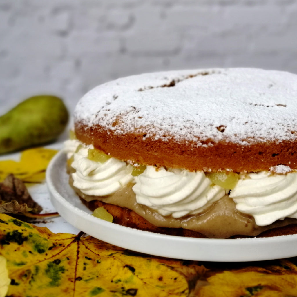 Pear and chestnut cake photographed from th side, showing the layers of chestnut cream, mascarpone chantilly and stewed pears. Copyright: the italian bkr